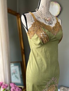 Vintage 1960's Aristocraft Green Lingerie Slip With Pink Floral Rose Embroidery & Brown Lace Dress/Nightgown - Sublime Lingerie brand, dating back from the 1930's, Aristocraft was a lingerie label established in 1936 by the Superior Petticoat Company of New York City. In addition to petticoats and slips, they also made Women's sleepwear. Since the company is no longer in operation, their pieces are more rare to come by! This beautiful green slip features a V-Neck Cut with brown lace decorating t Fitted Vintage Camisole For Spring, Fitted Sleeveless Sleepwear With Lace Patchwork, Fitted Slip Dress With Delicate Lace For Loungewear, Fitted Lace Slip Dress For Loungewear, Fitted Delicate Lace Slip Dress For Loungewear, Vintage Fitted Camisole With Delicate Lace, Vintage Lace Trim Camisole For Spring, Vintage Lace Camisole For Spring, Vintage Fitted Lace Camisole