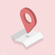 a pink pin is on top of a white piece of paper that has been placed in the shape of a map