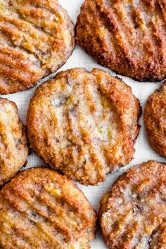 some cookies are sitting on a white surface