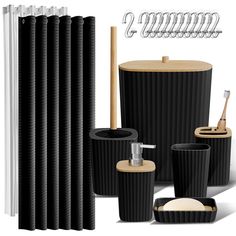 the bathroom accessories are all black and have wooden handles on each side, along with two toothbrush holders