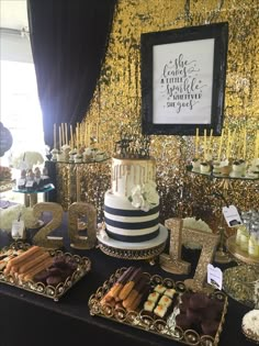 a table topped with lots of desserts next to a gold sequin wallpaper