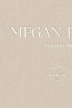 the logo for megan blvd real estate, inc is shown in white