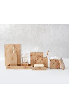 an assortment of wooden boxes with soap and toothbrushes in them