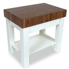 a white table with a butcher block on top