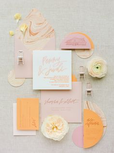 the wedding stationery was done in peach and gold