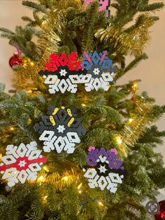 a decorated christmas tree with snowflakes on it