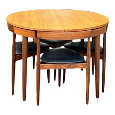 a wooden table with four chairs and a black leather seat on the bottom one chair