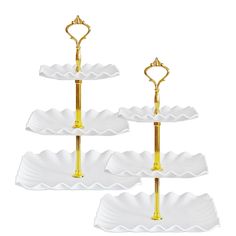 three tiered serving trays with gold handles and two heart shaped handles on each plate