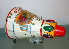 a toy rocket ship sitting on top of a table