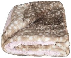 an animal print blanket is folded on top of each other with pink and white fur