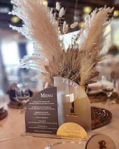 the table is set with an elegant centerpiece and place cards for guests to write their names