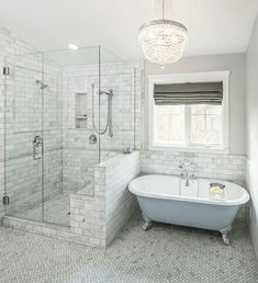 a bathroom with a bathtub, sink and shower in the center of the room