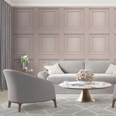 a living room with two chairs, a couch and a coffee table in front of a pink paneled wall