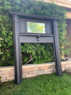 a large mirror sitting on the side of a building