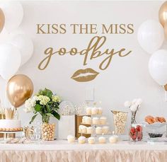 a table topped with lots of desserts and balloons next to a sign that says kiss the miss goodbye