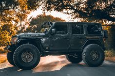 a black jeep parked on the side of a road