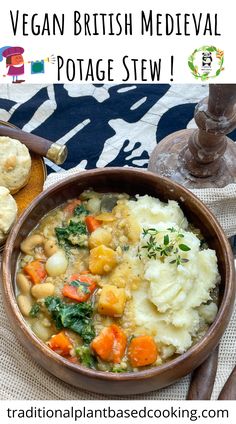 a bowl filled with stew and vegetables next to bread on a tablecloth covered place mat