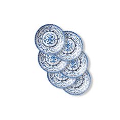 blue and white plates stacked on top of each other in the shape of a flower