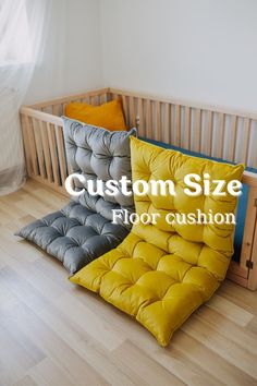 a baby crib with three different colored cushions on it and the words custom size floor cushion