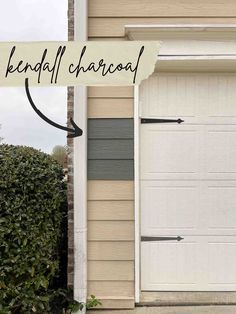 a white garage door with a sign that says, lenpaff charcoal