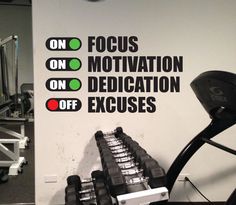 there is a sign on the wall that says focus, motivation, dedication, and exercises