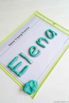 there is a cake with the word ellen spelled out in blue and green icing