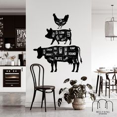 a black and white photo of a kitchen wall with cows cut out of butcher paper