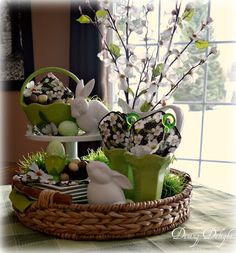 a basket filled with easter decorations on top of a table