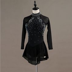 a black and white figure skating dress on a mannequin