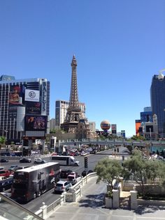 the eiffel tower towering over the city of las vegas, nv as seen from across the street