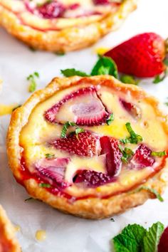 strawberry cheesecake tarts with fresh strawberries on top