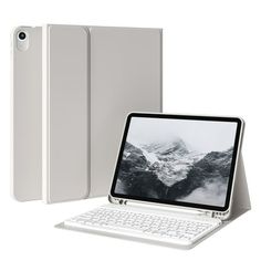 an open laptop computer sitting next to a white keyboard and case on a white background