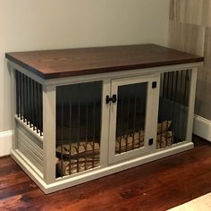 a dog kennel with two dogs in it's cages on the floor