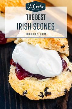 the best irish scones with cream and cranberry sauce on top is shown