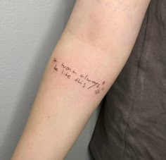 a woman's arm with writing on it