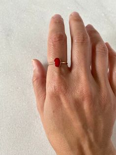 This gorgeous red coral will be set in your choice of metal: sterling silver or gold filled or solid 14k. Each ring is handmade to order in your size.  This is a natural color enhanced coral.  Please allow some variation in color and appearance.  Some of the stones may have a few white specks and a coral matrix. Coral is actually considered a gemstone.  It is composed of calcium carbonate with a trace of carotene (hence a carrot color) deposited by tiny sea creatures living in the depths of warm seas in big colonies. DETAILS:  Coral:6x8mm (small) Model wears size 7, 1.3mm gold filled band. Solid gold sales are final. Thank you Tiny Sea Creatures, Coral Rings, Coral Stone Ring, Summer Minimal, Red Coral Ring, Carrot Colour, Ocean And Beach, Gold Ring Band, Red Gemstone Ring