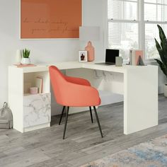 a white desk with an orange chair next to it