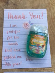 a handwritten thank note with a bottle of peaches on it next to a sign that says, thank you i am grateful for the hands that have guided me this year