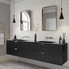 a bathroom with two sinks and mirrors on the wall