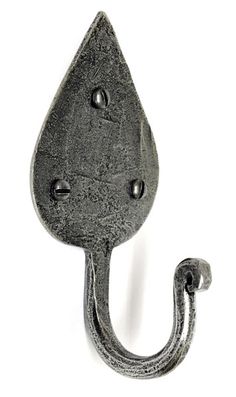 an iron hook with a water drop on it