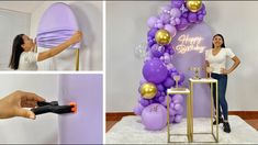 a woman is decorating a balloon arch with purple and gold balloons