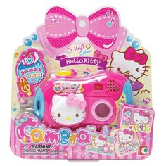 a pink hello kitty toy camera in its package with stickers on the front and side