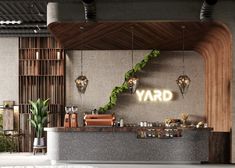 the bar is decorated with greenery and gold letters that spell out yard on it