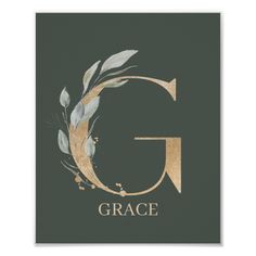 the letter g in gold and green with leaves on it's side, against a black background