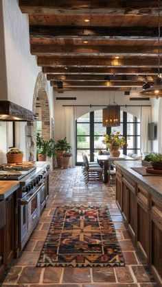 a kitchen with an area rug on the floor