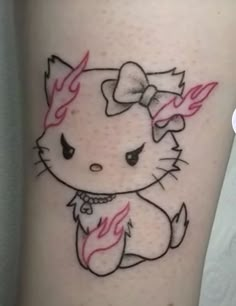 a tattoo with a hello kitty on it's leg and pink flames coming out of her chest