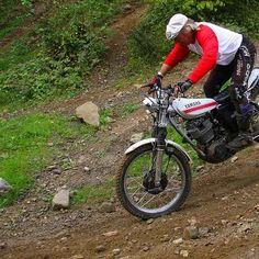 a man riding on the back of a dirt bike