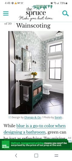 an image of a bathroom with green and white wallpaper on the walls in it