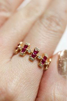 Lily Red Pink Ruby Art Deco Multi Stone Ring exudes a stunning sophistication. Striking in its clean lines the vertically set pink ruby gemstones baguettes across the center of the 18K yellow gold vermeil band. ◊ 18K Gold Vermeil ◊ Available in US ring size 5-7, size 8-9 are made to order and will take 3 weeks ◊ Pink ruby cubic zirconias ◊ Delivered in our beautiful custom made Pina Blue box, perfect for gifting! SAY HI TO US Instagram: @thepinablue Pinterest: https://www.pinterest.com/thepinabl Wizard Jewelry, Celestial Ring, Alternative Engagement Ring, Pink Ruby, Gold Rings Fashion, Circle Diamond, Tourmaline Necklace, Alternative Engagement Rings, Vermeil Jewelry