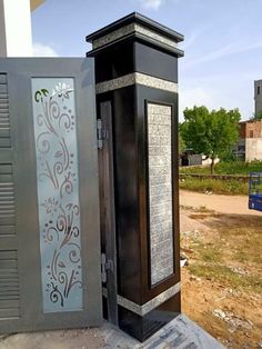 an old phone booth sitting on the side of a road